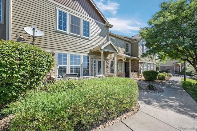 12753 Leyden St Unit C, Thornton, CO 80602 - view of front facade with stone siding