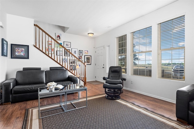 12753 Leyden St Unit C, Thornton, CO 80602 - living area featuring stairway, wood finished floors, and healthy amount of natural light