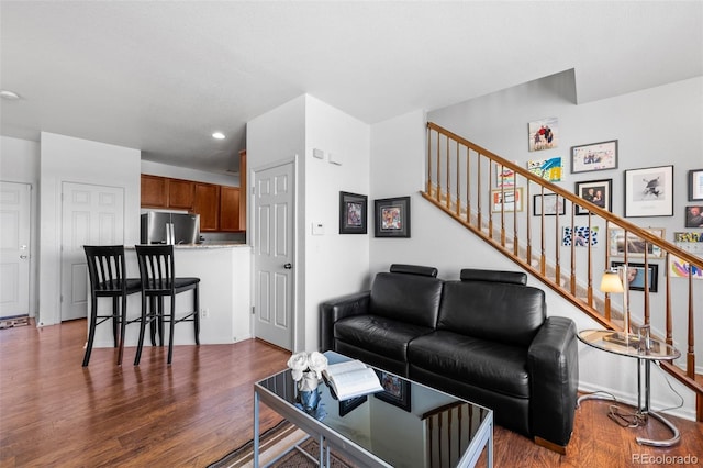 12753 Leyden St Unit C, Thornton, CO 80602 - living area featuring dark wood-style floors, stairs, and recessed lighting