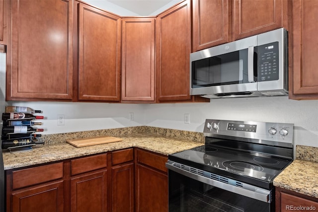 12753 Leyden St Unit C, Thornton, CO 80602 - kitchen with stainless steel appliances and light stone countertops