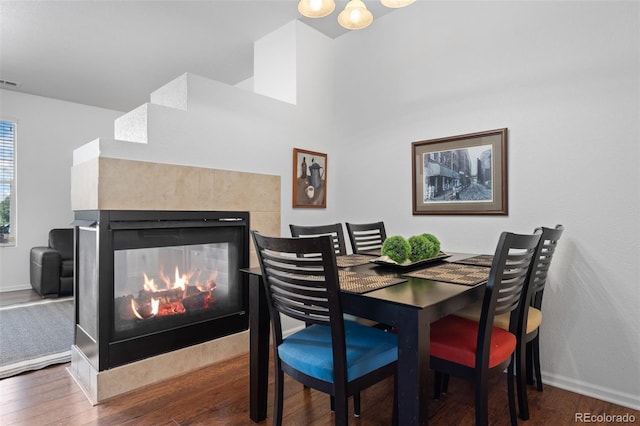 12753 Leyden St Unit C, Thornton, CO 80602 - dining room featuring wood finished floors and a tiled fireplace