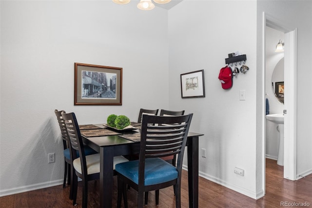 12753 Leyden St Unit C, Thornton, CO 80602 - dining room featuring wood finished floors and a chandelier