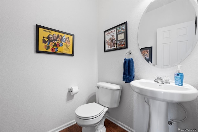 12753 Leyden St Unit C, Thornton, CO 80602 - bathroom featuring wood finished floors and toilet