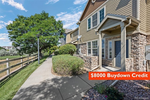 12753 Leyden St Unit C, Thornton, CO 80602 - view of side of property with stone siding