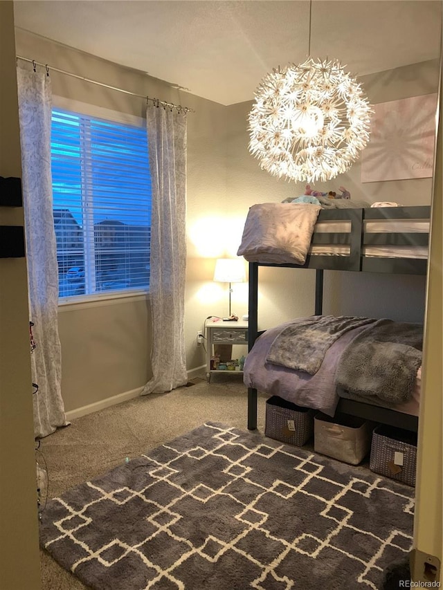 3173 Youngheart Way, Castle Rock, CO 80109 - bedroom featuring carpet, baseboards, and a chandelier