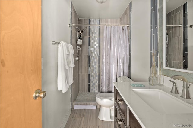 bathroom with vanity, toilet, and a shower with shower curtain