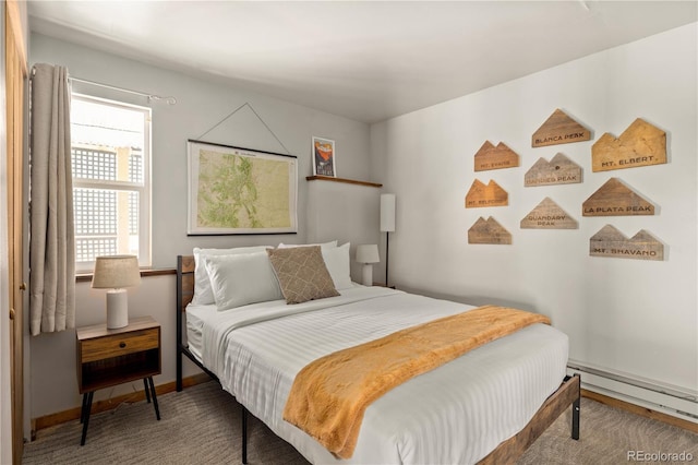 carpeted bedroom featuring multiple windows and baseboard heating