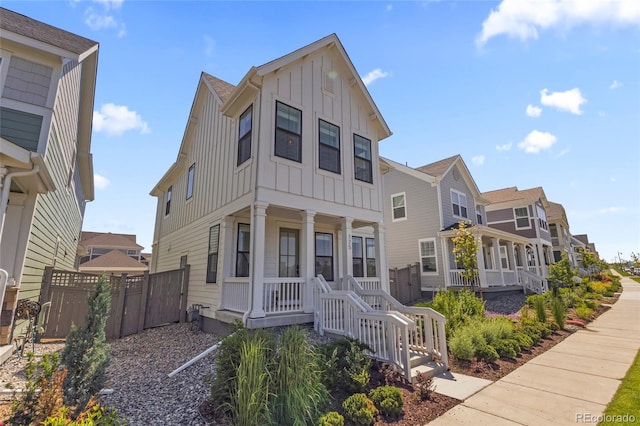 175 Westerly Blvd, Erie, CO 80516 - view of front of home with board and batten siding, a porch, a residential view, and a gate