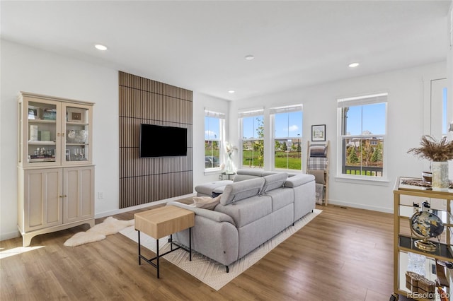 175 Westerly Blvd, Erie, CO 80516 - living area featuring wood finished floors and recessed lighting