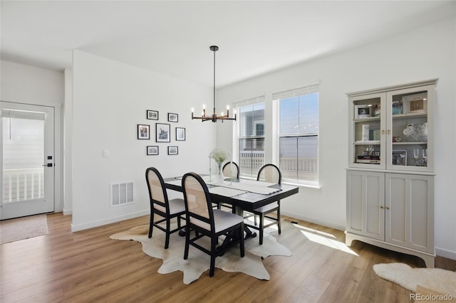 175 Westerly Blvd, Erie, CO 80516 - dining space with wood finished floors and a chandelier