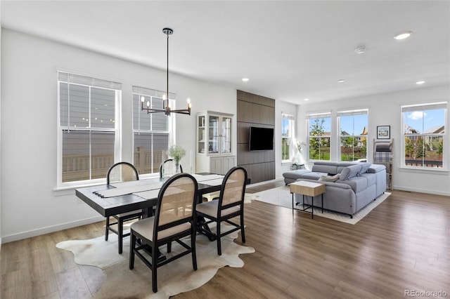 175 Westerly Blvd, Erie, CO 80516 - dining area with a chandelier, recessed lighting, and wood finished floors