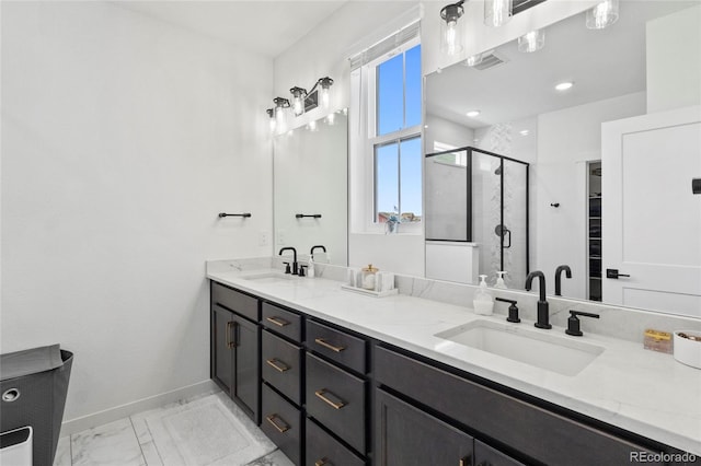 175 Westerly Blvd, Erie, CO 80516 - bathroom with double vanity, a shower stall, and marble finish flooring