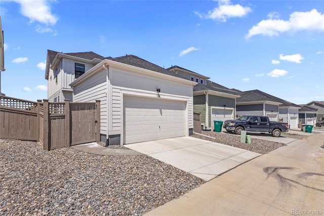 175 Westerly Blvd, Erie, CO 80516 - view of property exterior featuring driveway, a gate, a garage, and roof with shingles