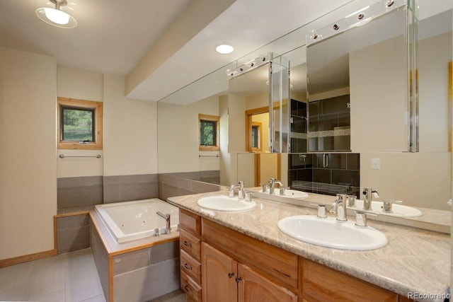 13190 Coyote Song Trl, Conifer, CO 80433 - full bathroom featuring a jetted tub, double vanity, a shower stall, and tile patterned floors