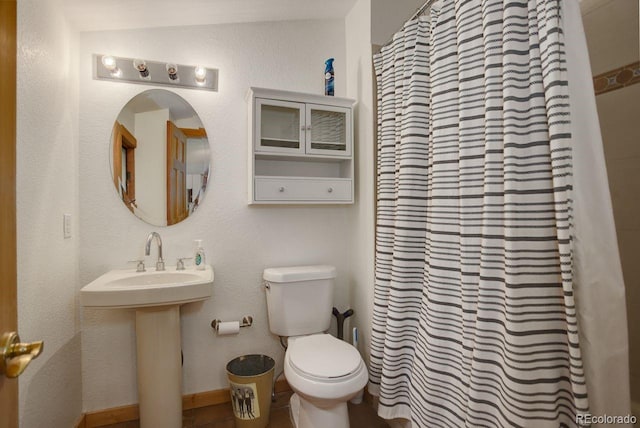 13190 Coyote Song Trl, Conifer, CO 80433 - full bath featuring toilet, a shower with curtain, and a sink