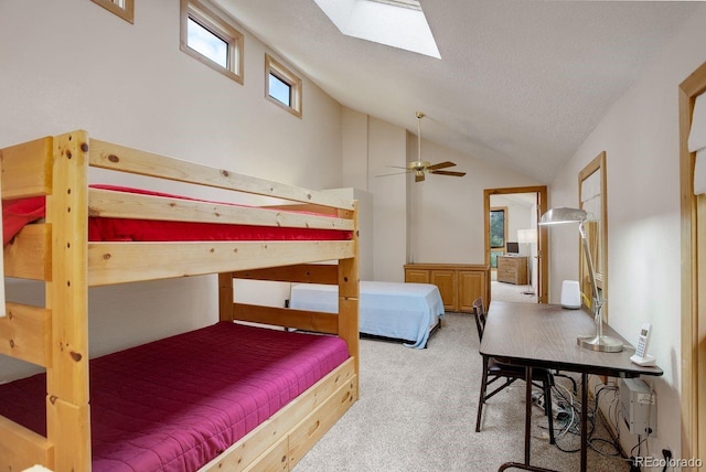 13190 Coyote Song Trl, Conifer, CO 80433 - carpeted bedroom with lofted ceiling, a skylight, and a textured ceiling