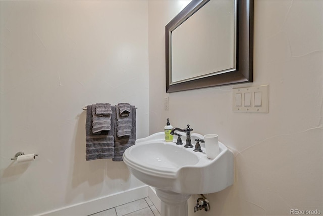 bathroom with tile patterned flooring and sink