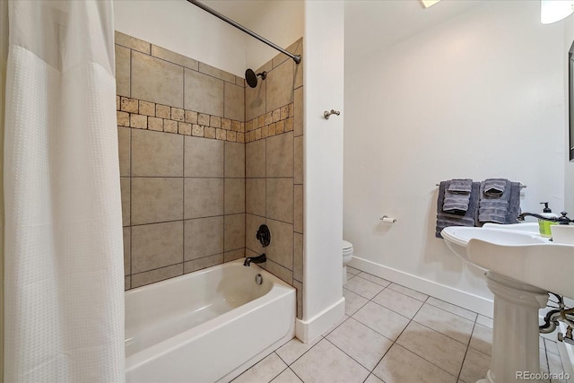 bathroom with tile patterned floors, toilet, and shower / bath combo