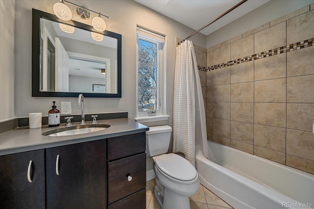 full bathroom featuring tile patterned flooring, vanity, toilet, and shower / tub combo with curtain