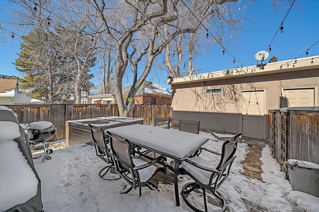 view of snow covered patio