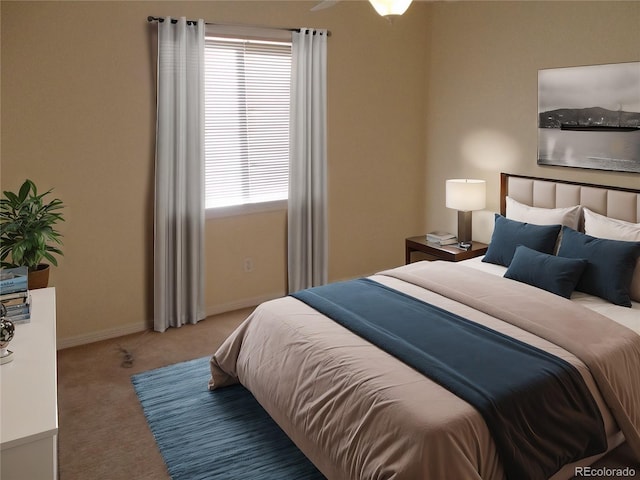 bedroom with baseboards and carpet flooring