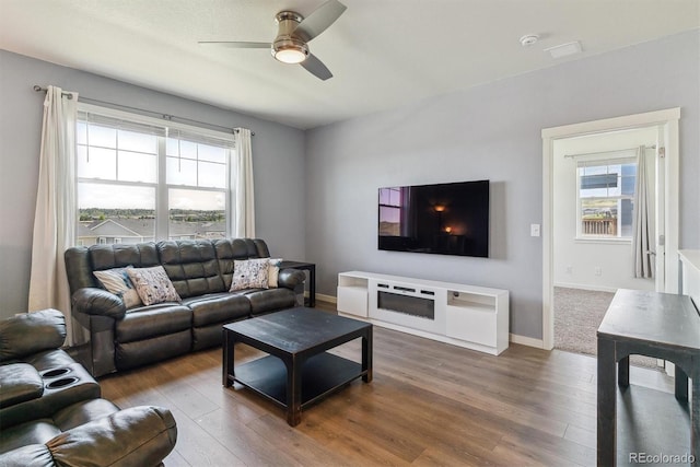 4992 Trails Edge Ln, Castle Rock, CO 80104 - living area with ceiling fan, hardwood / wood-style flooring, and baseboards