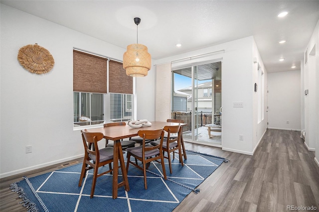 dining space featuring hardwood / wood-style flooring