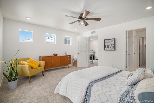 bedroom featuring ceiling fan and light carpet