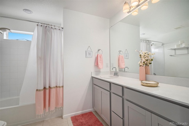 bathroom featuring tile patterned floors, shower / bath combo, and vanity