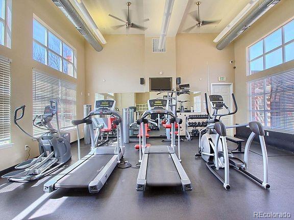 4100 Albion St Unit 612, Denver, CO 80216 - workout area featuring a high ceiling and ceiling fan