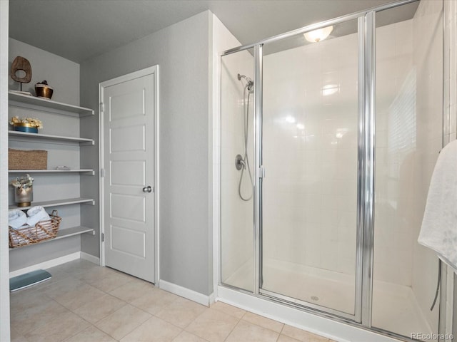 bathroom featuring tile patterned floors and walk in shower