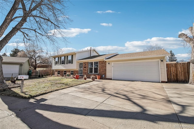 tri-level home with a front yard and a garage