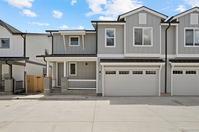 view of front of home with a porch and a garage