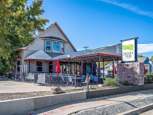 4018 Upham St, Wheat Ridge, CO 80033 - view of front facade featuring a porch and fence