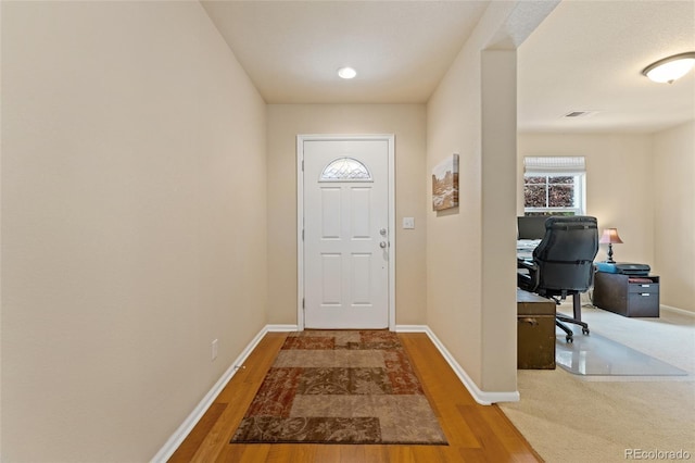 doorway with wood-type flooring