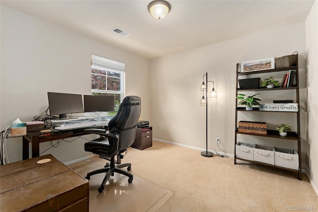 office space featuring light carpet