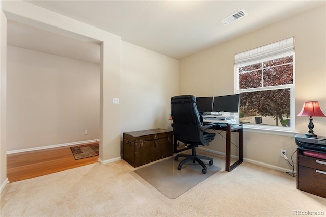 carpeted office with plenty of natural light