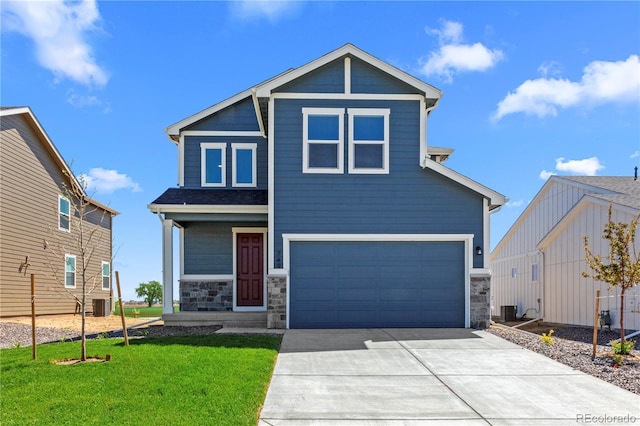 view of front of home featuring concrete driveway, an attached garage, stone siding, a front lawn, and covered porch