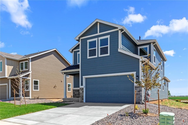 view of front of house featuring a garage, driveway, and stone siding