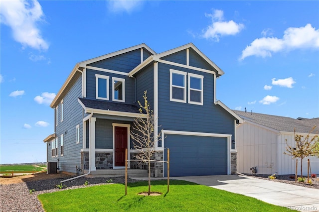 view of front of home featuring an attached garage, central air condition unit, concrete driveway, a front yard, and stone siding
