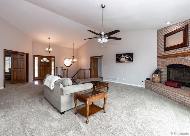 1660 Old Antlers Way, Monument, CO 80132 - living area with light colored carpet, a fireplace, a chandelier, a ceiling fan, and high vaulted ceiling