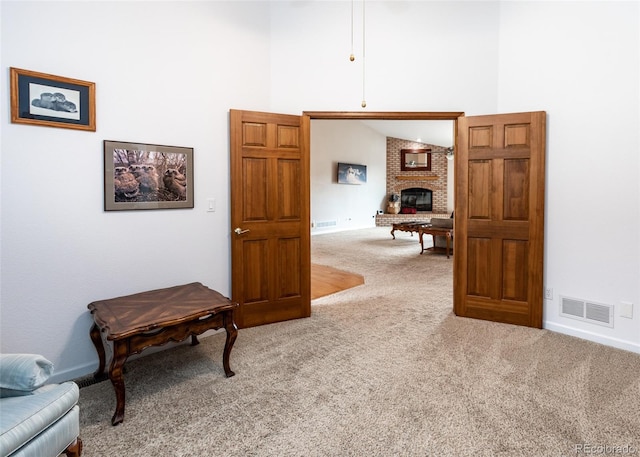 1660 Old Antlers Way, Monument, CO 80132 - corridor featuring carpet flooring and a towering ceiling