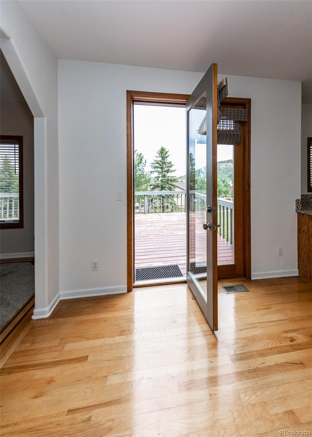 1660 Old Antlers Way, Monument, CO 80132 - doorway to outside with light wood finished floors and french doors