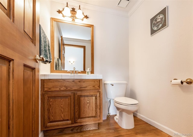 1660 Old Antlers Way, Monument, CO 80132 - bathroom featuring vanity, crown molding, and wood finished floors