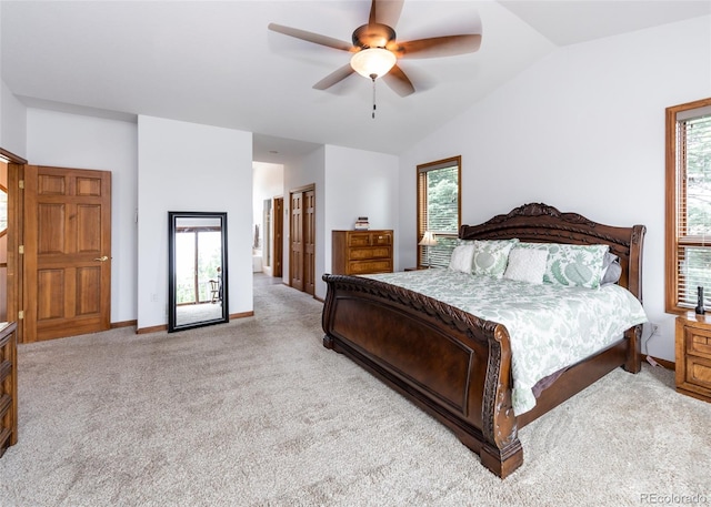 1660 Old Antlers Way, Monument, CO 80132 - carpeted bedroom featuring lofted ceiling, multiple windows, and a ceiling fan