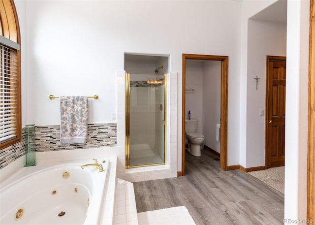 1660 Old Antlers Way, Monument, CO 80132 - full bathroom featuring a stall shower, a whirlpool tub, and wood finished floors