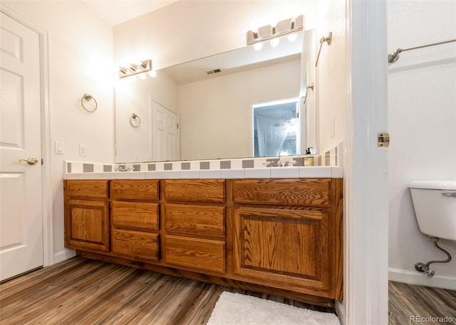 1660 Old Antlers Way, Monument, CO 80132 - bathroom featuring wood finished floors and double vanity
