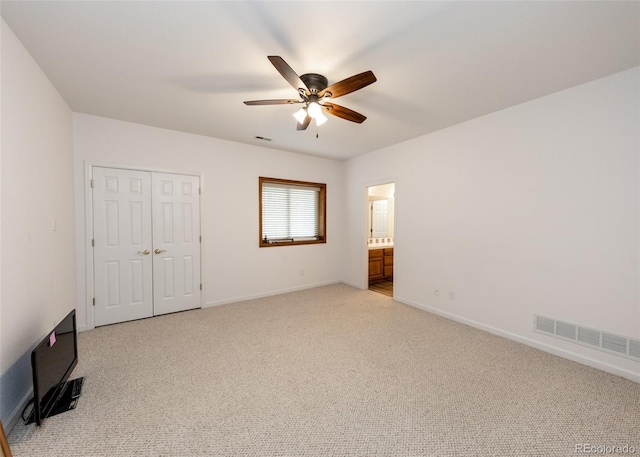 1660 Old Antlers Way, Monument, CO 80132 - unfurnished bedroom with light colored carpet, a closet, and a ceiling fan