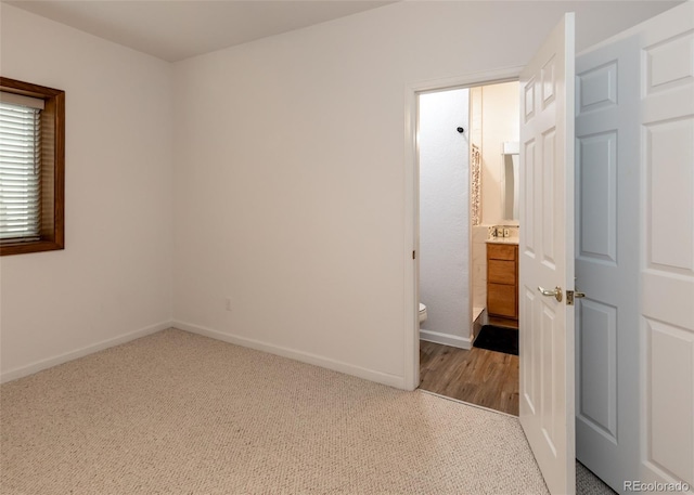 1660 Old Antlers Way, Monument, CO 80132 - carpeted spare room featuring baseboards and a sink