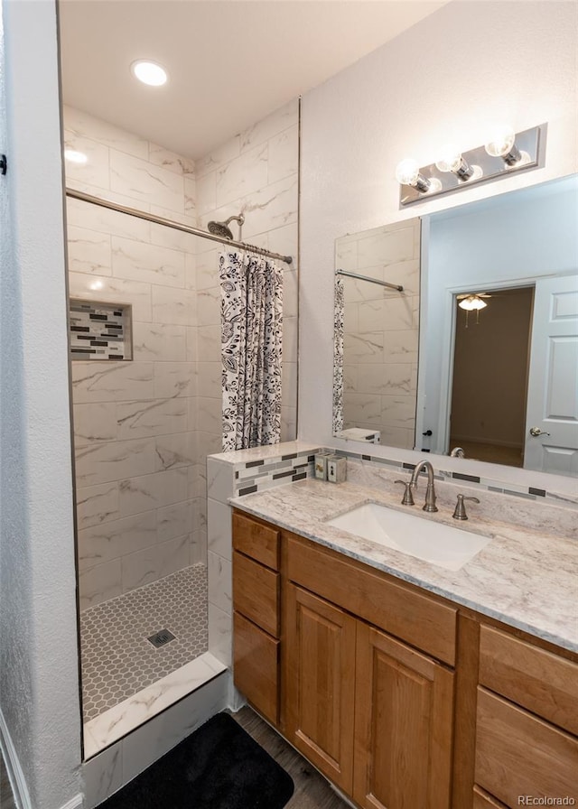 1660 Old Antlers Way, Monument, CO 80132 - full bathroom featuring a tile shower and vanity